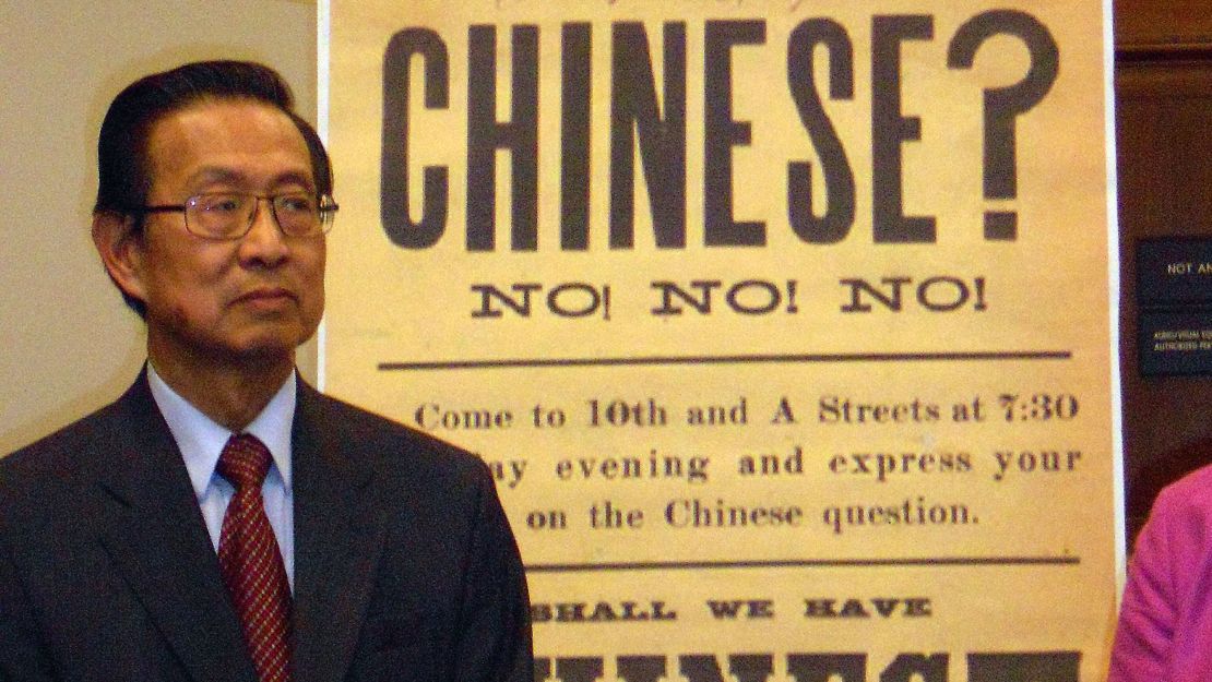 A coalition of rights groups  pushed Congress to pass resolutions expressing regret over the Chinese Exclusion Act. In this 2011 file photo, Michael Lin, then chair of the 1882 Project, is shown speaking at the US House of Representatives in front of a reproduction of a 19th-century sign that aimed to rouse up sentiment against Chinese Americans. 