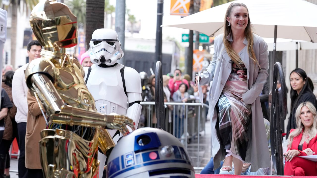 Billie Lourd with 'Star Wars' droid characters at her mom Carrie Fisher's posthumous Hollywood Walk of Fame ceremony in Los Angeles on May 4. 