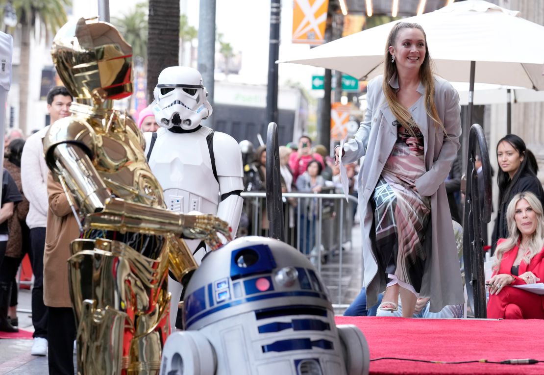 Billie Lourd with 'Star Wars' droid characters at her mom Carrie Fisher's posthumous Hollywood Walk of Fame ceremony in Los Angeles on May 4. 