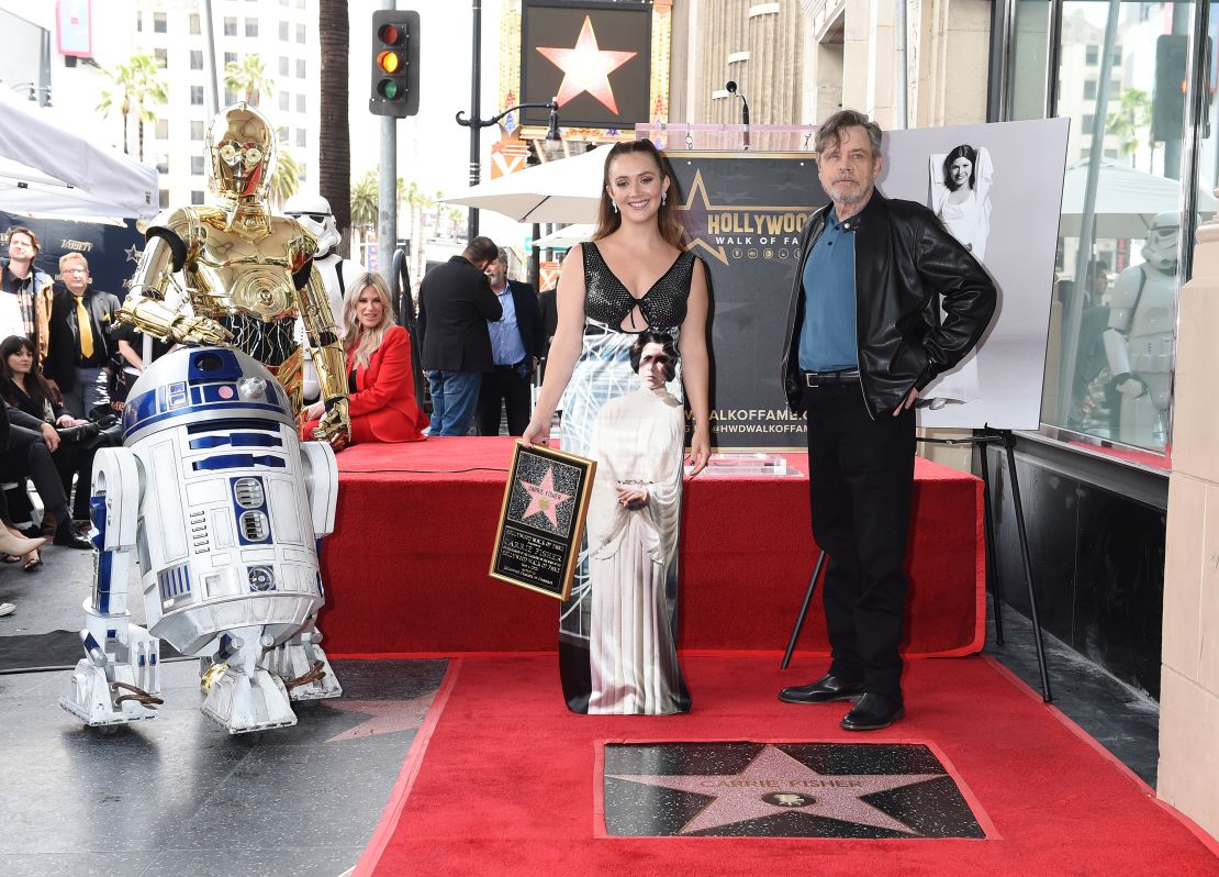 (From left) R2D2, C3P0, Billie Lourd and Mark Hamill at Carrie Fisher's Walk of Fame ceremony in Los Angeles on May 4. 