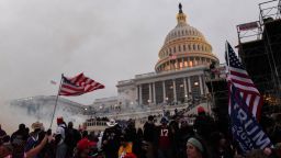 FILE PHOTO: Police clear the U.S. Capitol Building with tear gas as supporters of U.S. President Donald Trump gather outside, in Washington, U.S. January 6, 2021. REUTERS/Stephanie Keith/File Photo