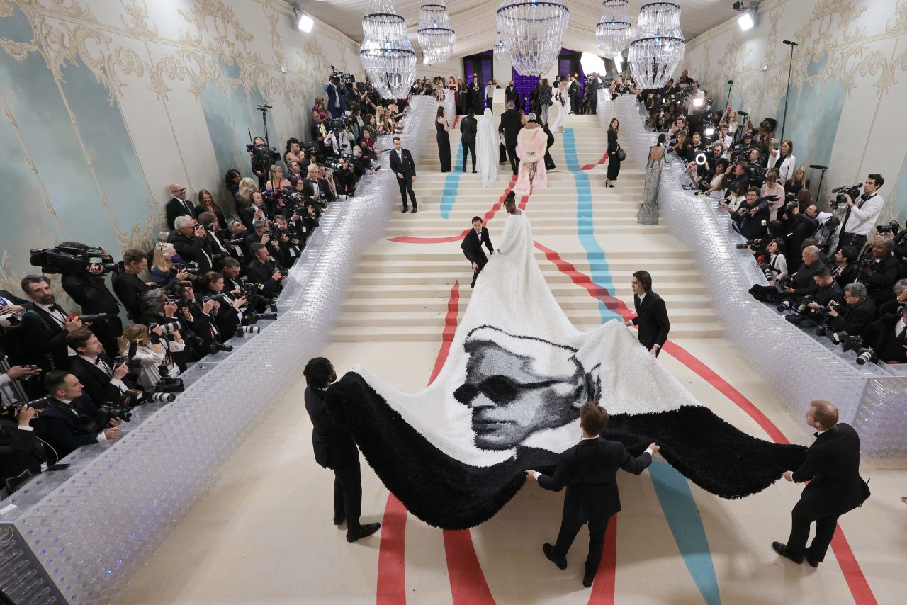 Actor Jeremy Pope wears a long cape with a black-and-white profile of late designer Karl Lagerfeld at the Met Gala in New York on Monday, May 1. Lagerfeld was the focus of this year's Met Gala, fashion's most extravagant night. <a href="https://www.cnn.com/style/article/met-gala-2023-red-carpet-fashion/index.html" target="_blank">See the best red-carpet looks</a>.