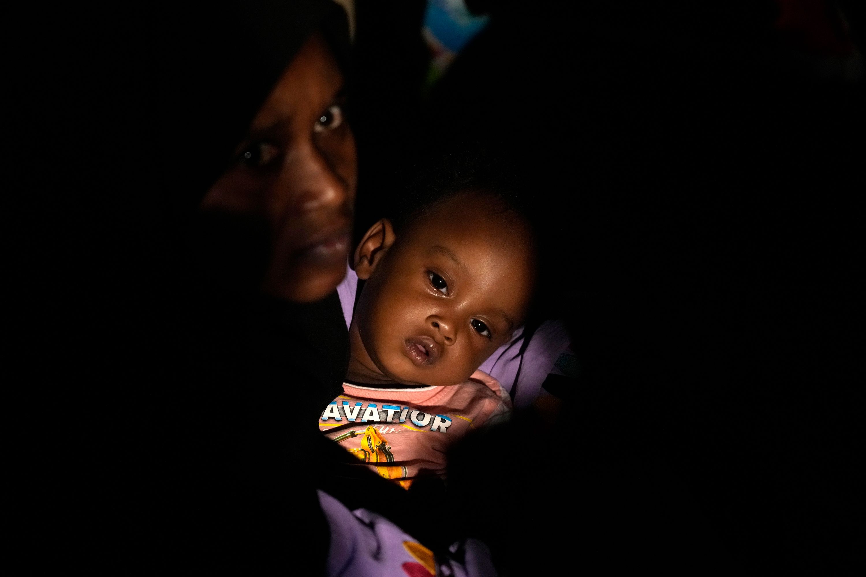 Evacuees wait at Port Sudan before boarding a Saudi military ship to flee Sudan on Tuesday, May 2.