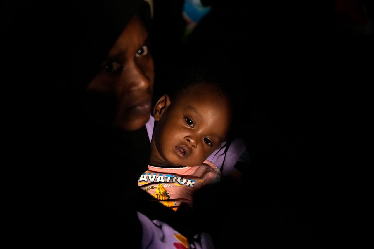 Evacuees wait at Port Sudan before boarding a Saudi military ship to flee Sudan on Tuesday, May 2. Forces loyal to two rival generals are vying for control of Sudan, and the <a href=