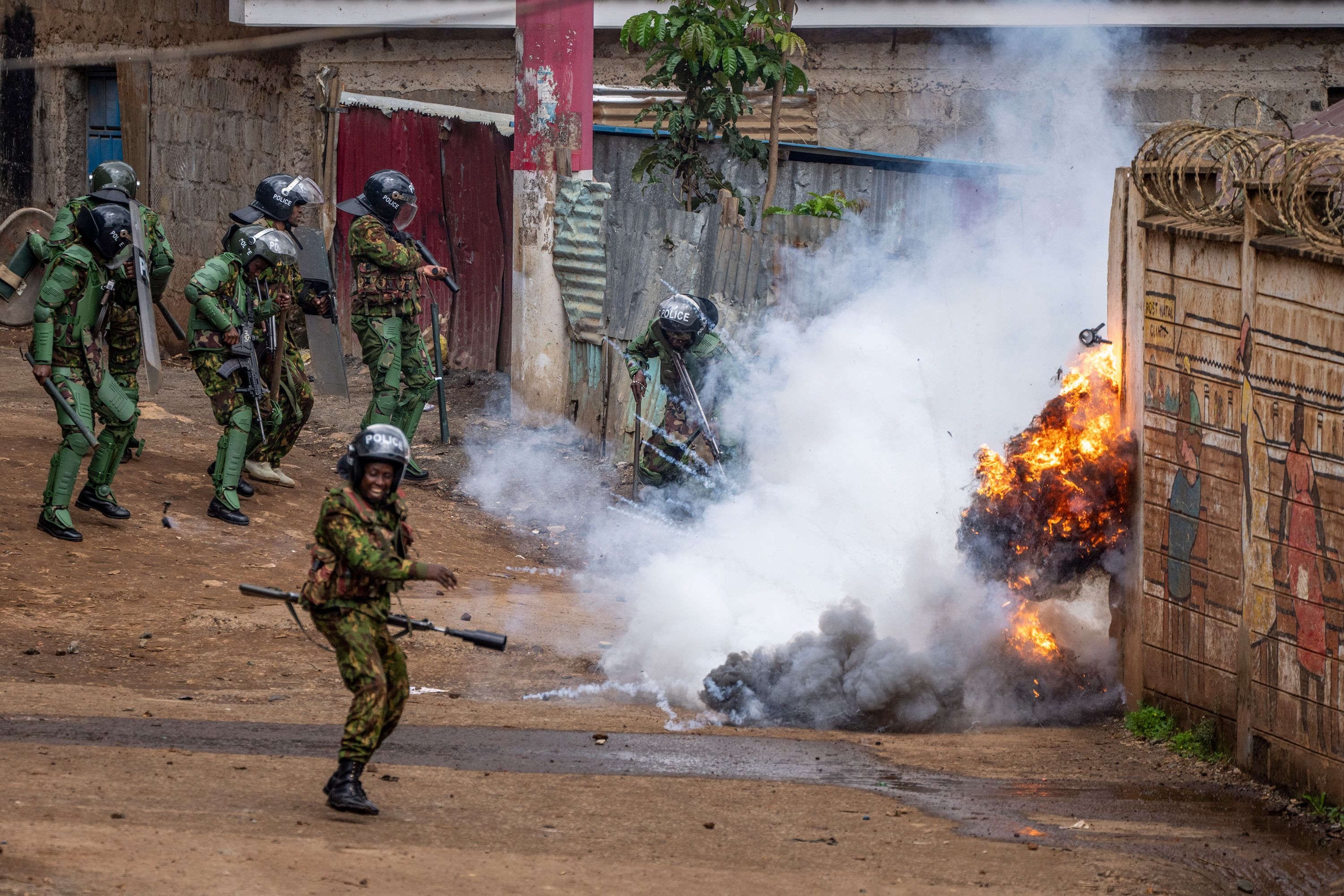 Riot police react during clashes with anti-government protesters in Nairobi, Kenya.