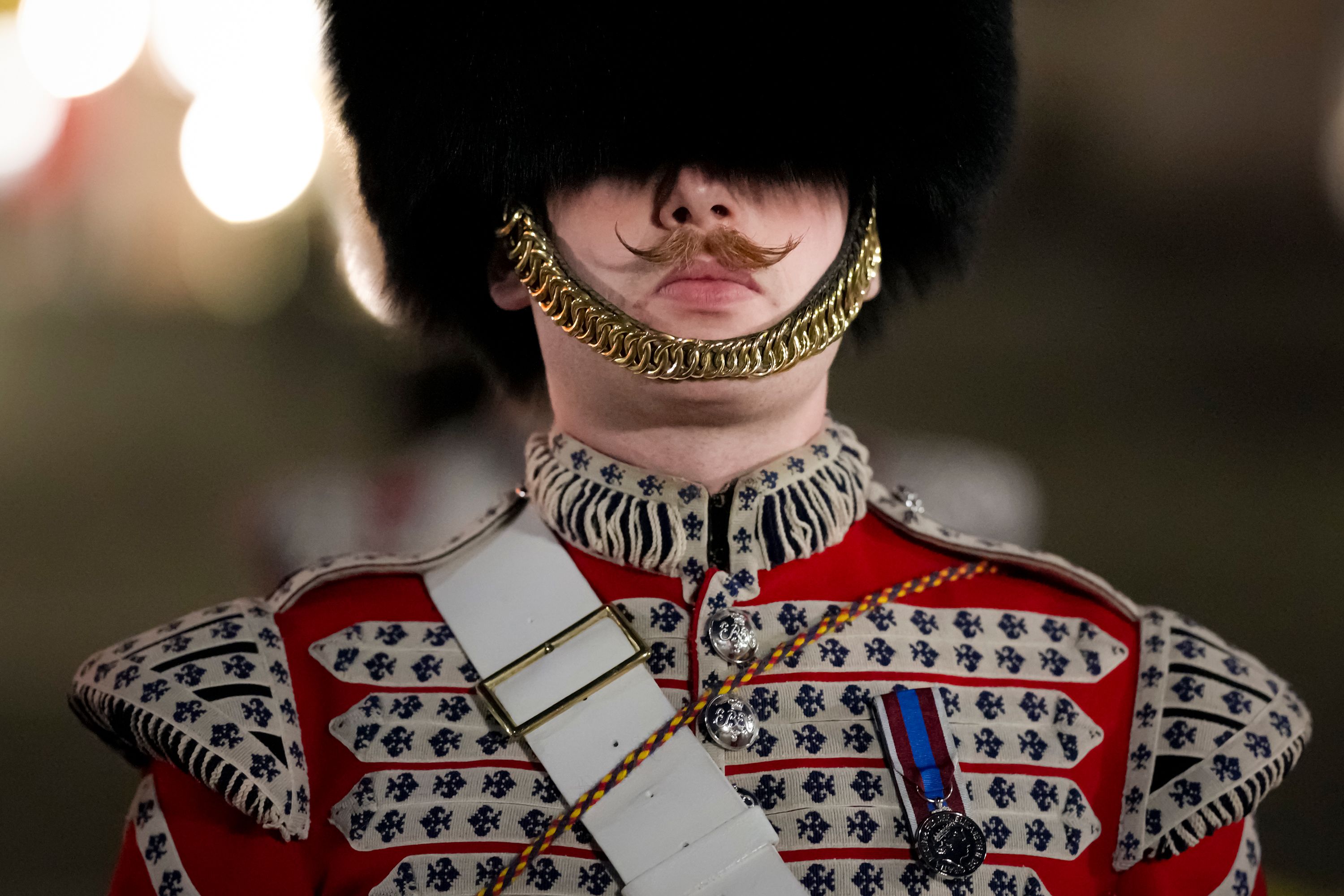 A military member marches during a rehearsal for the coronation of King Charles III.