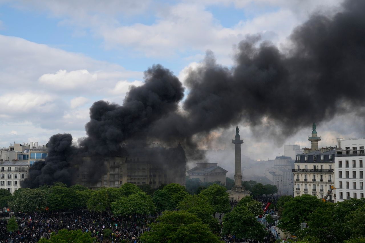 Smoke billows in Paris after a fire was set during May Day demonstrations on Monday, May 1. <a href=