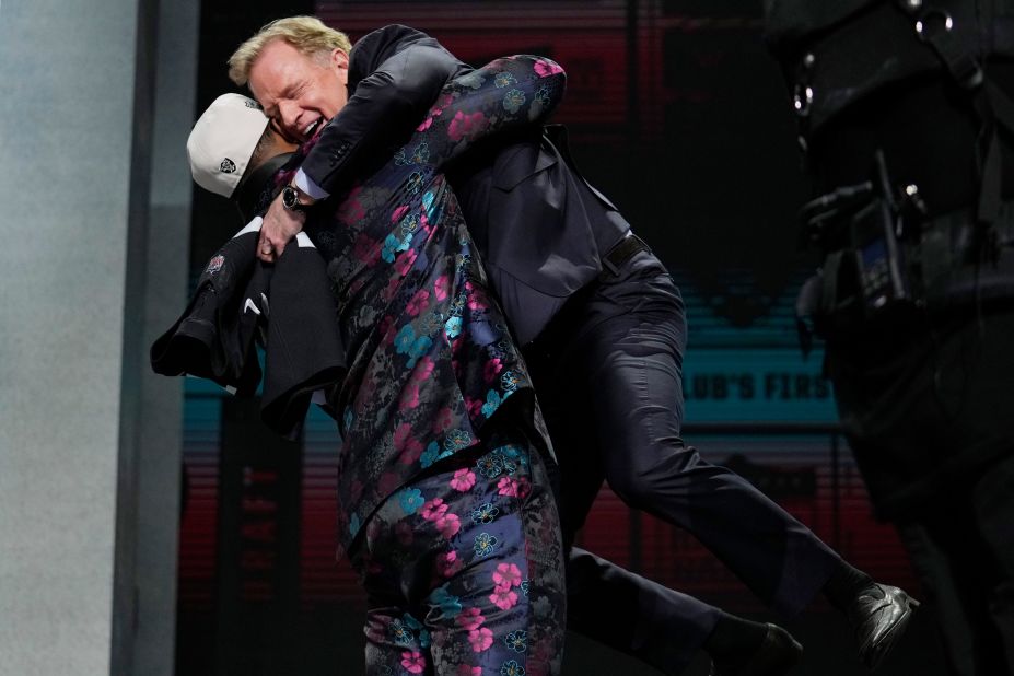 Tyree Wilson, a defensive lineman from Texas Tech, lifts up NFL Commissioner Roger Goodell after the Las Vegas Raiders chose him with the seventh overall pick of the NFL Draft on Thursday, April 27.