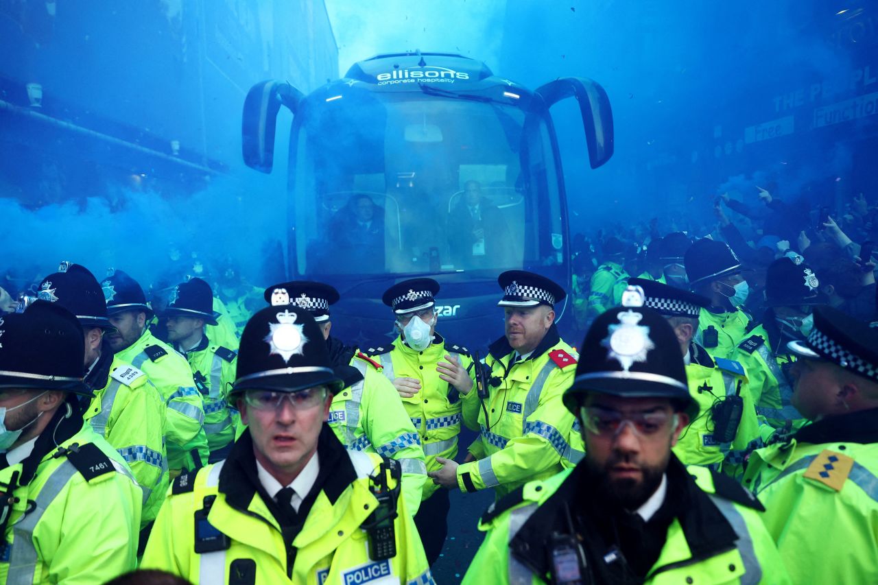 Police officers are seen in front of the Everton team bus before the Premier League team hosted Newcastle in Liverpool, England, on Thursday, April 27.