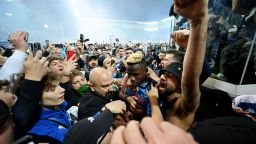 Victor Osimhen is surrounded by Napoli fans after the team wins the Serie A title.