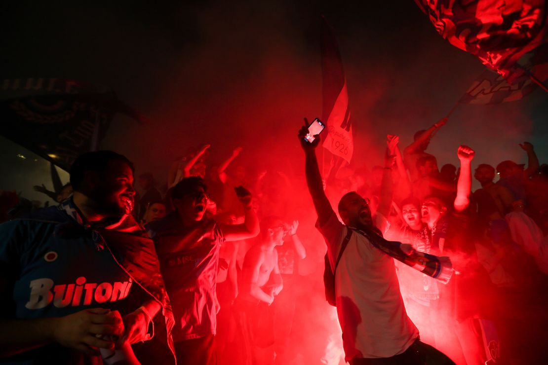 Napoli fans celebrate the team's Serie A title victory on the streets of Naples. 