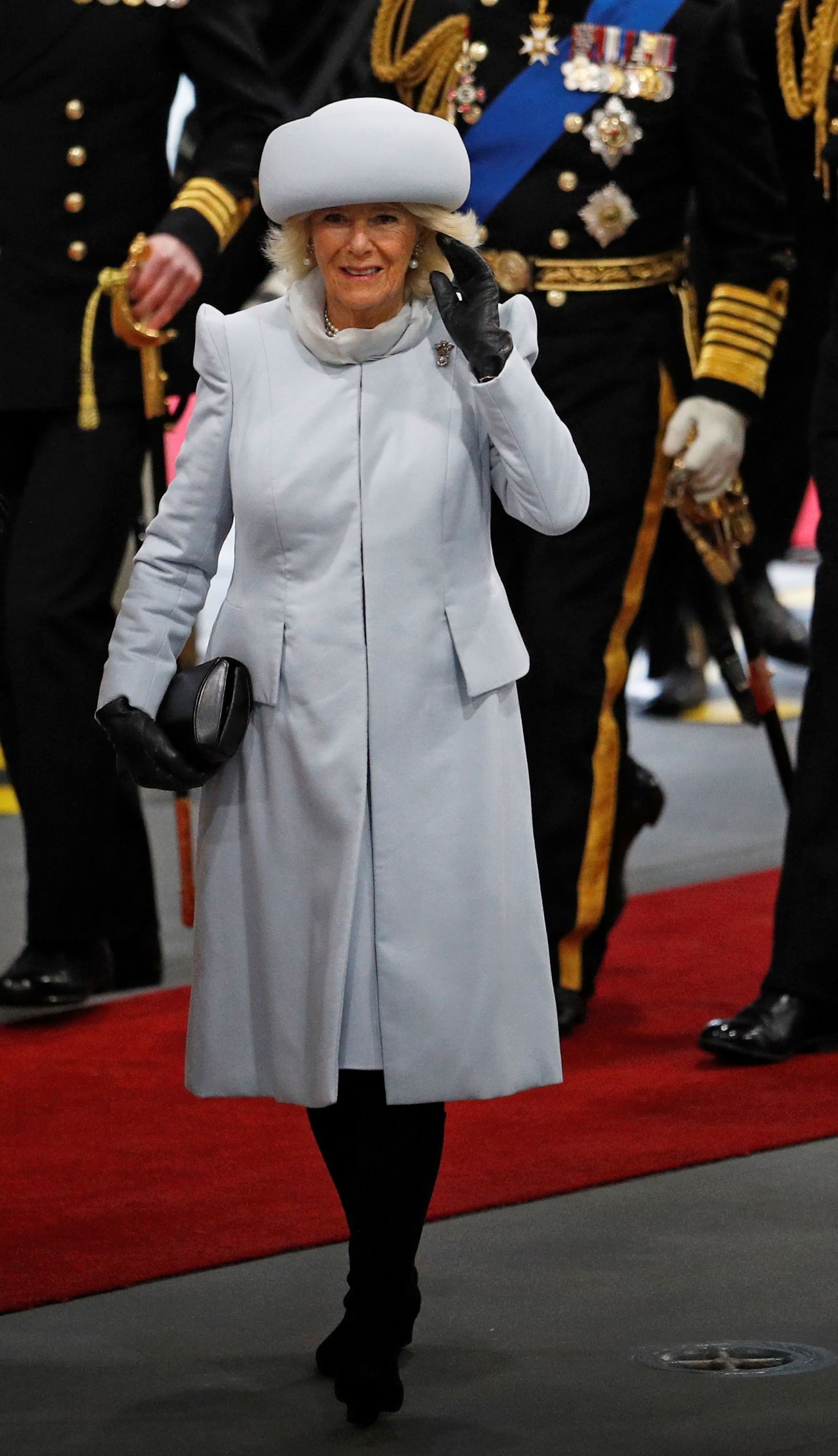 Dressed in an icy blue Bruce Oldfield dresscoat and a matching pillbox hat, Camilla's outfit (worn to the official commissioning ceremony of a new aircraft carrier in Portsmouth) made headlines for its sleek appearance.