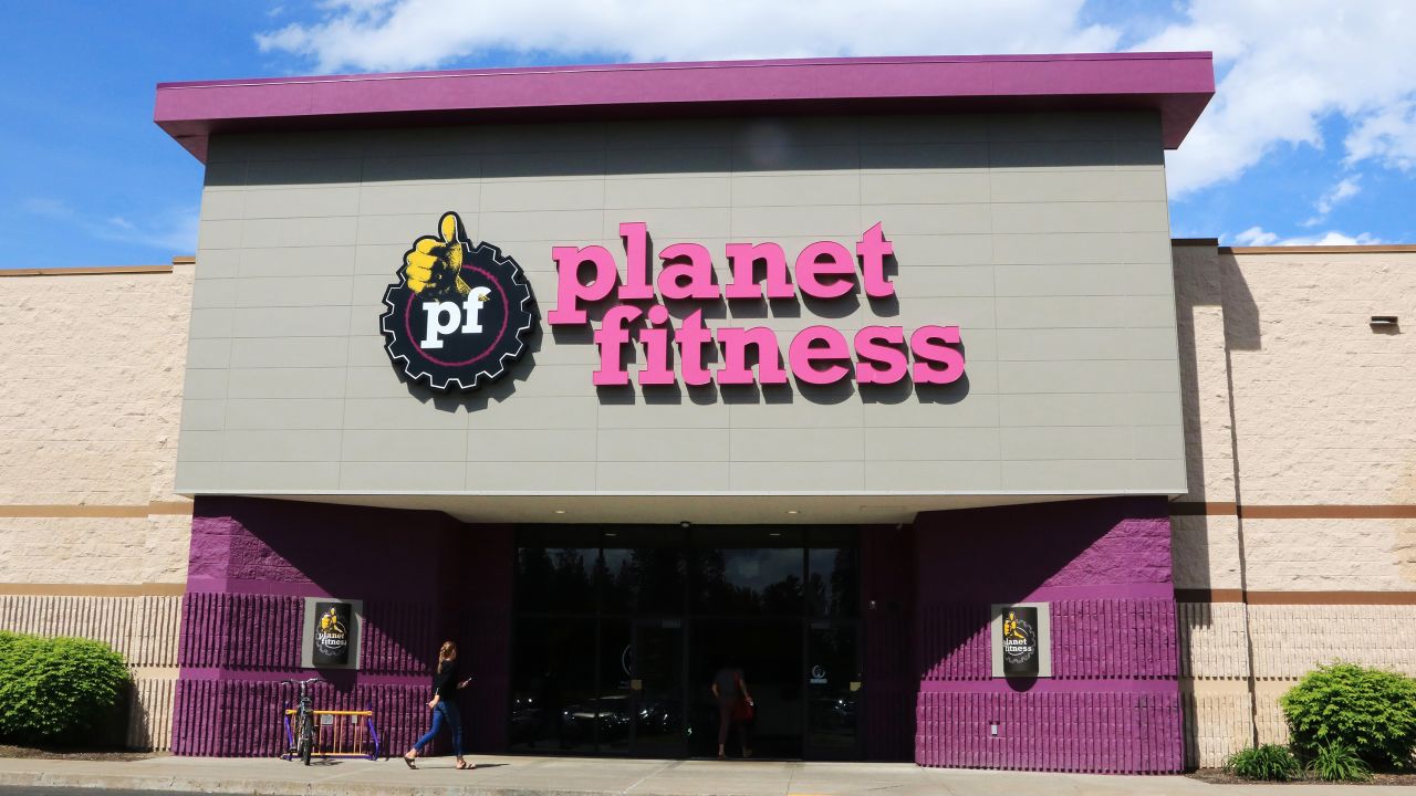 Planet Fitness health center entrance showing company logo above doors. 