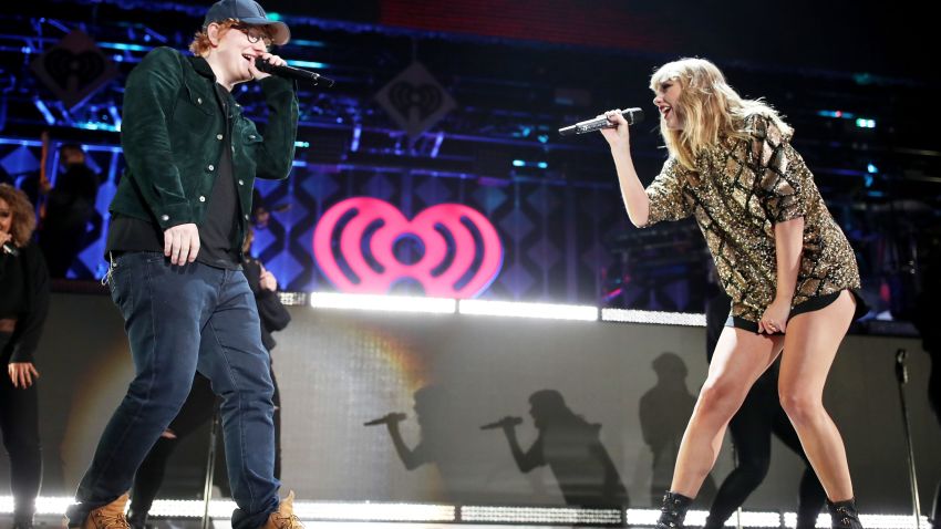 INGLEWOOD, CA - DECEMBER 01:  (EDITORIAL USE ONLY. NO COMMERCIAL USE)  Ed Sheeran (L) and Taylor Swift  perform onstage during 102.7 KIIS FM's Jingle Ball 2017 presented by Capital One at The Forum on December 1, 2017 in Inglewood, California.  (Photo by Christopher Polk/Getty Images for iHeartMedia)