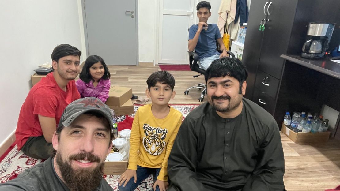 Joe Robert, lower left, sitting at EHC with Aziz, an interpreter, kicked off a group effort of US veterans to help evacuate Afghans to the UAE. 