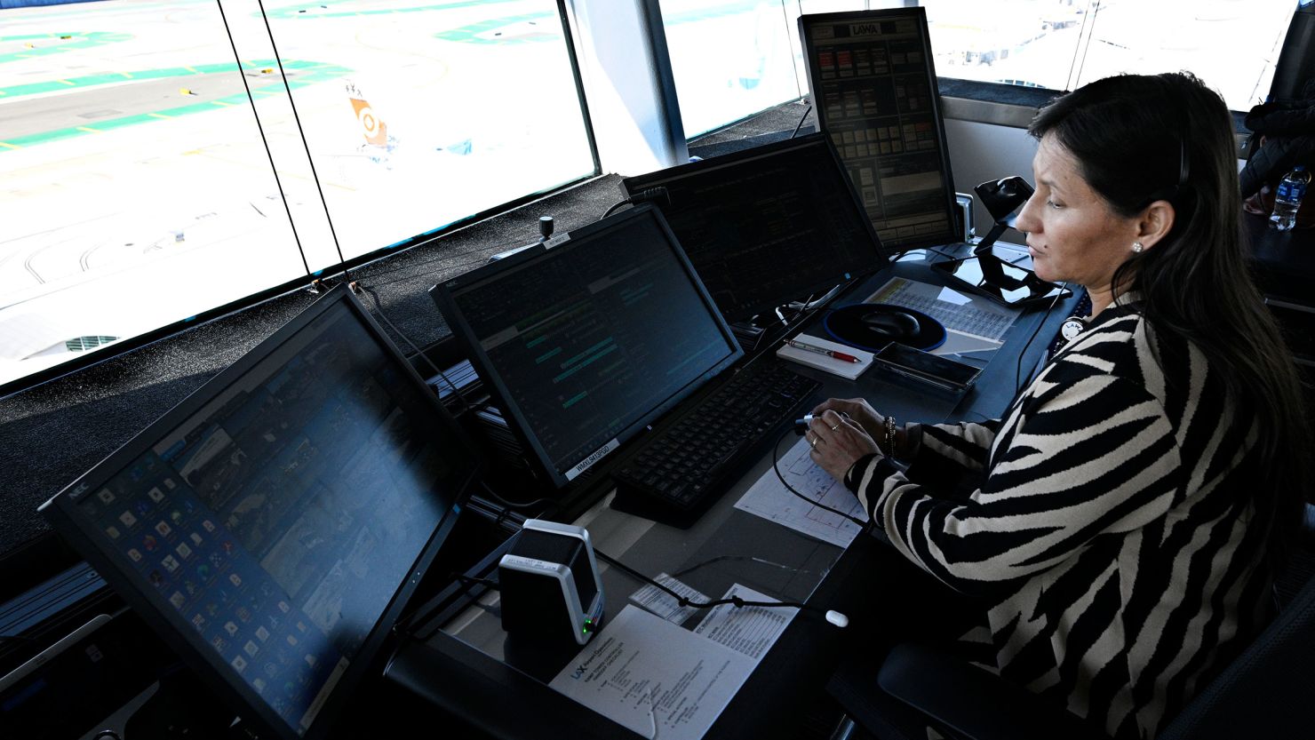 Mayra Raya-Cruz working air traffic control during the holiday travel rush at Los Angeles International Airport in Los Angeles on December 21, 2022.