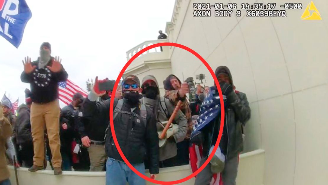 In this image from a Washington Metropolitan Police Department officer's body-worn video camera, released and annotated by the Justice Department in the Government's Sentencing Memorandum, Peter Schwartz circled in red is shown using a canister of pepper spray against officers on January 6, 2021, in Washington.