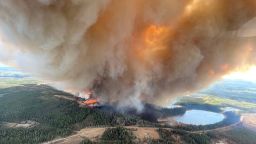 A smoke column rises from wildfire near Lodgepole, Alberta, Canada on May 4, 2023.