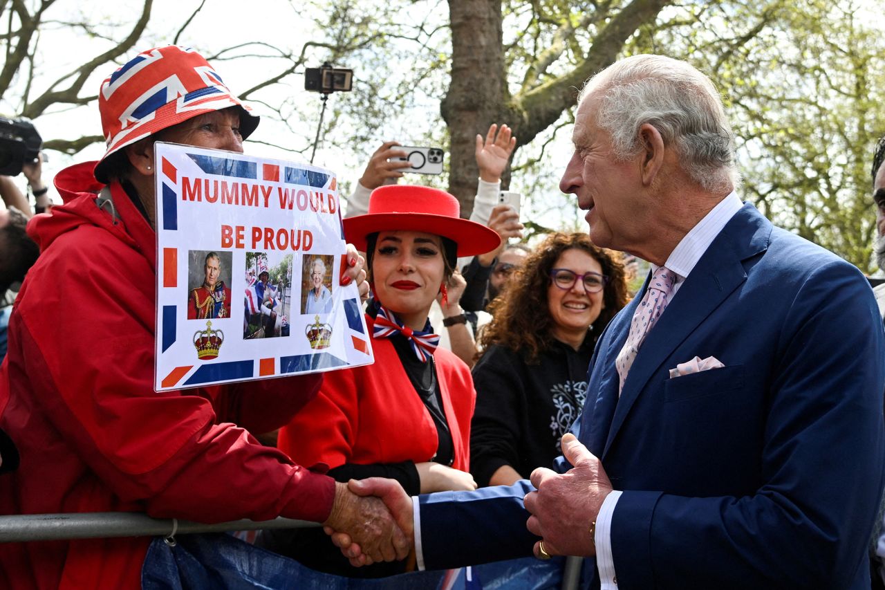 The King meets well-wishers outside Buckingham Palace during a walkabout on Friday.