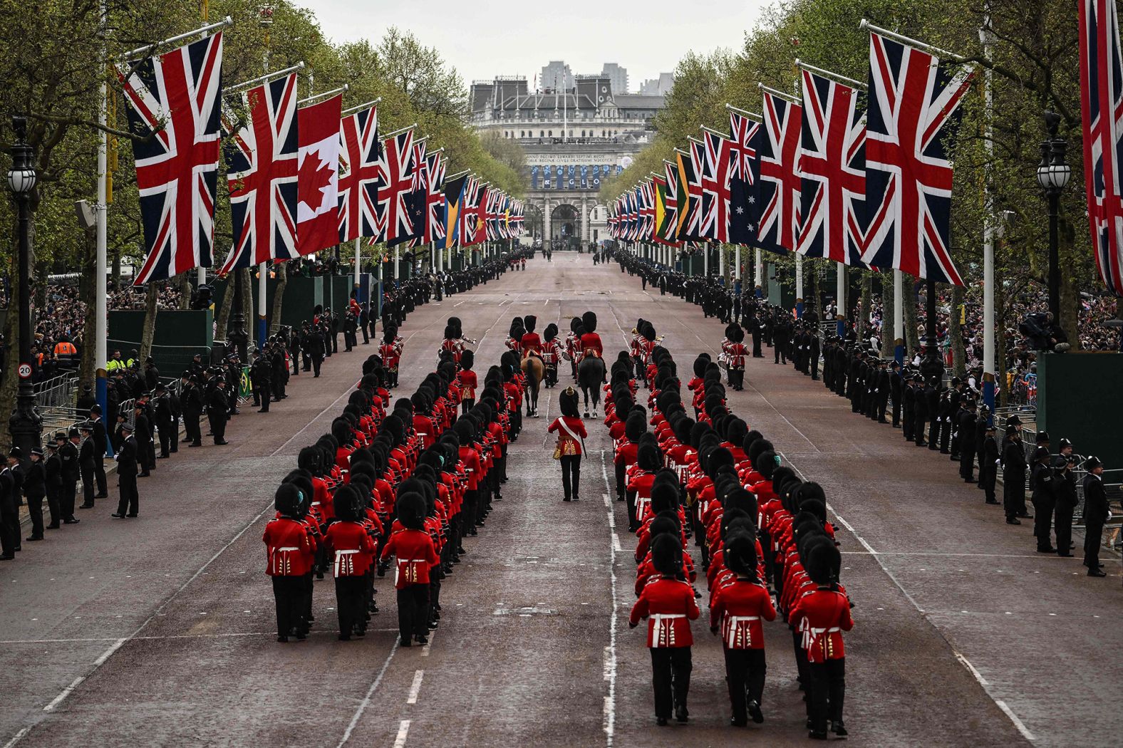 Members of the Coldstream Guards march on the procession route before the coronation.