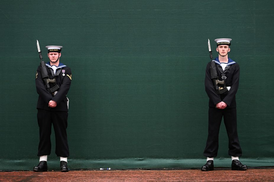 Royal Navy sailors stand at attention on the Mall in London.