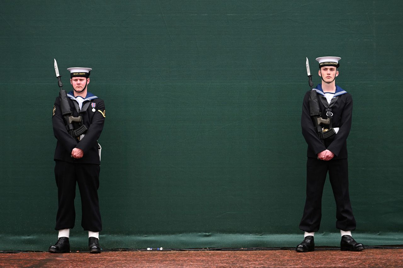 Royal Navy sailors stand at attention on the Mall in London.