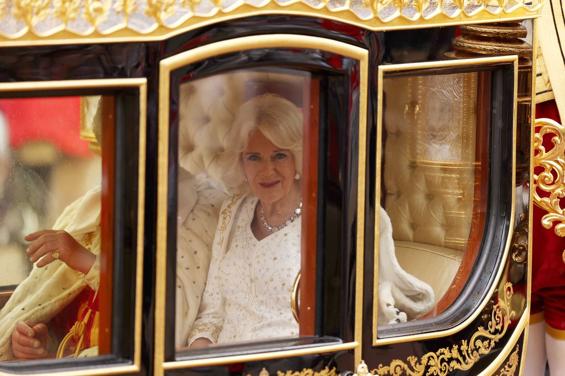 Queen Camilla arriving in the Diamond Jubilee Coach wearing her ermine Robe of State.