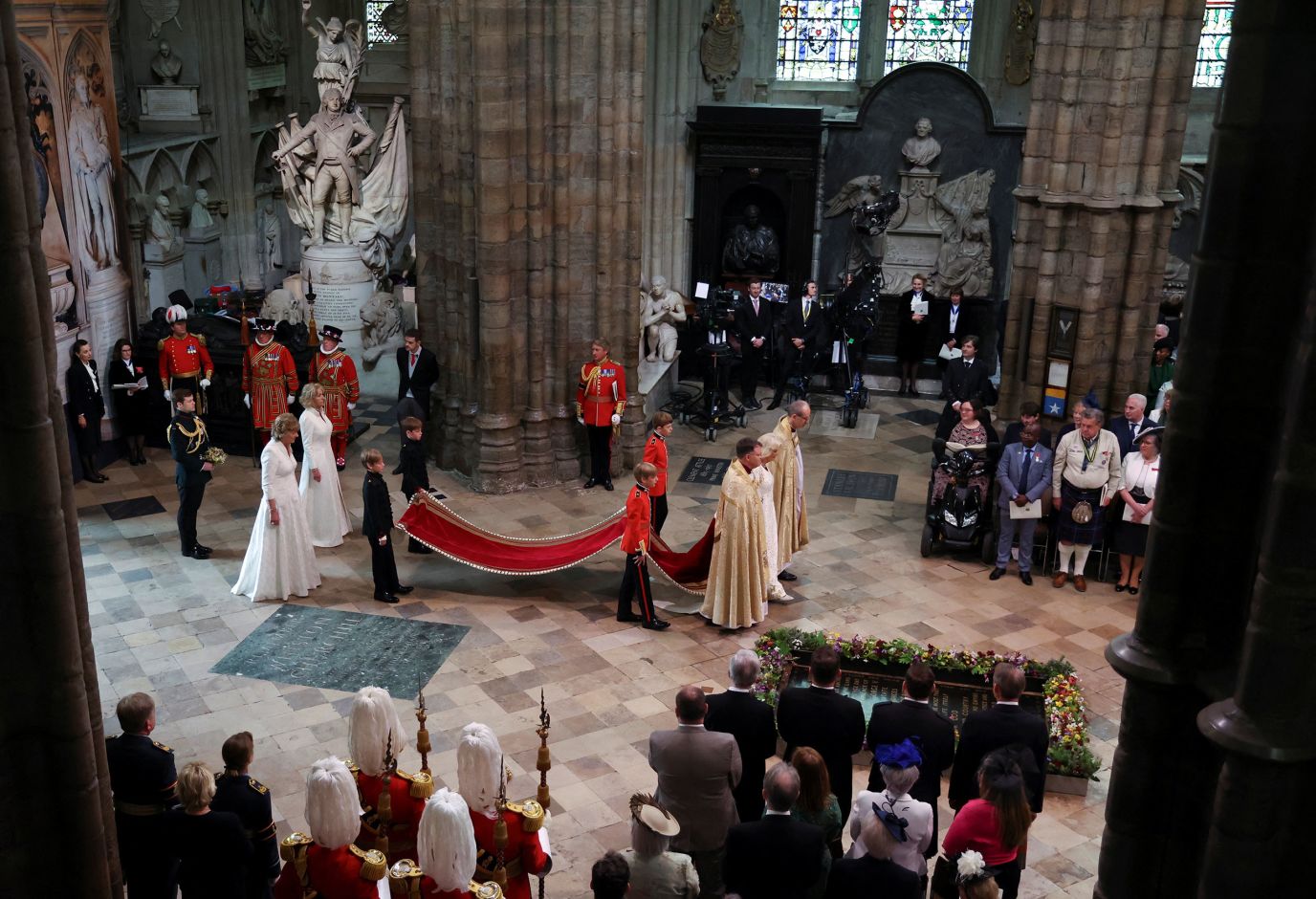 The Queen enters Westminster Abbey. The King and Queen <a href='https://www.cnn.com/uk/live-news/king-charles-iii-coronation-ckc-intl-gbr/h_94f8991ad84c43b4548be766efd7779c' target='_blank'>entered the Abbey</a> to the strains of 'I was glad,' the stirring coronation anthem written by Hubert Parry for the coronation of King Edward VII in 1902. It has been sung at all coronations since then.