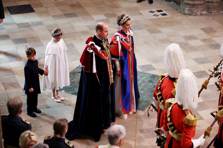 Prince William, Harry's brother, and Catherine, the Princess of Wales, <a href="https://www.cnn.com/uk/live-news/king-charles-iii-coronation-ckc-intl-gbr/h_90cacda1164e4f41a0953249e6219dc0" target="_blank">arrive for the coronation</a> with Prince Louis and Princess Charlotte.