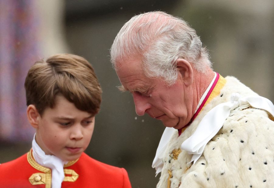 The King is seen near his grandson Prince George, one of his pages of honor.