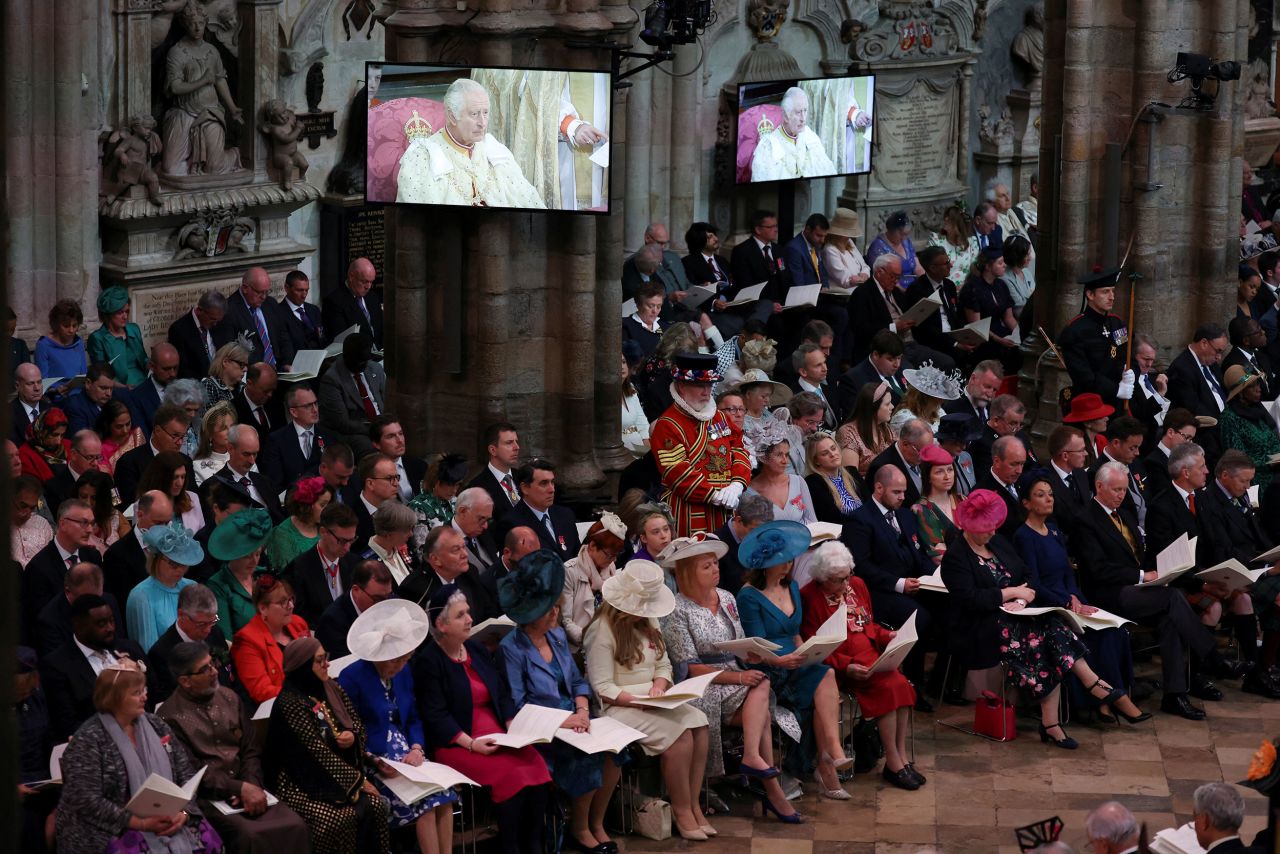 Guests watch the coronation ceremony at Westminster Abbey.