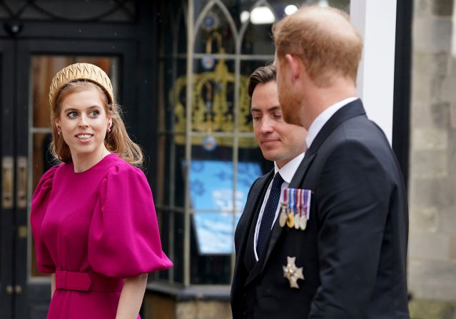 Prince Harry, right, arrives at Westminster Abbey along with Princess Beatrice, one of the King's nieces, and her husband, Edoardo Mapelli Mozzi.  <a href="index.php?page=&url=https%3A%2F%2Fwww.cnn.com%2Fuk%2Flive-news%2Fking-charles-iii-coronation-ckc-intl-gbr%2Fh_d46a1c2f25cd5c5ed888c323a5411ae9" target="_blank">Harry accepted the invitation to his father's coronation</a> but was without his wife, Meghan, who stayed back in California with the couple's two children.