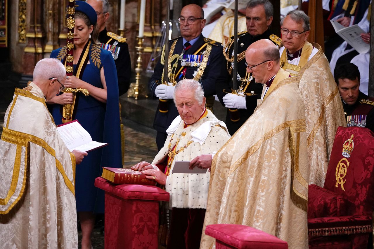 The King places his hands on the Coronation Bible as he <a href="https://www.cnn.com/uk/live-news/king-charles-iii-coronation-ckc-intl-gbr/h_329d6fba5cd3c92110395f5152360553" target="_blank">takes the Coronation Oath</a>.