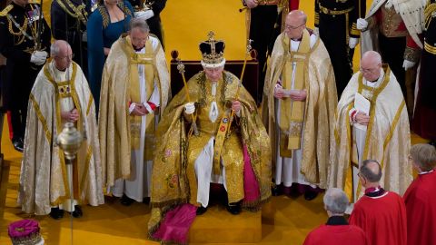 Britain's King Charles III receives The St Edward's Crown during his coronation ceremony at Westminster Abbey, in London, Saturday May 6, 2023. (Andrew Matthews/Pool via AP)