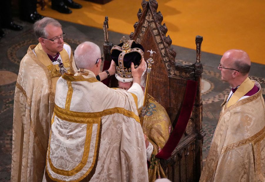 The Archbishop of Canterbury Justin Welby <a href="https://www.cnn.com/uk/live-news/king-charles-iii-coronation-ckc-intl-gbr/h_0a26f9200f7038d529cbcb8cb39e0871" target="_blank">places the St. Edward's Crown onto the head of the King</a>.