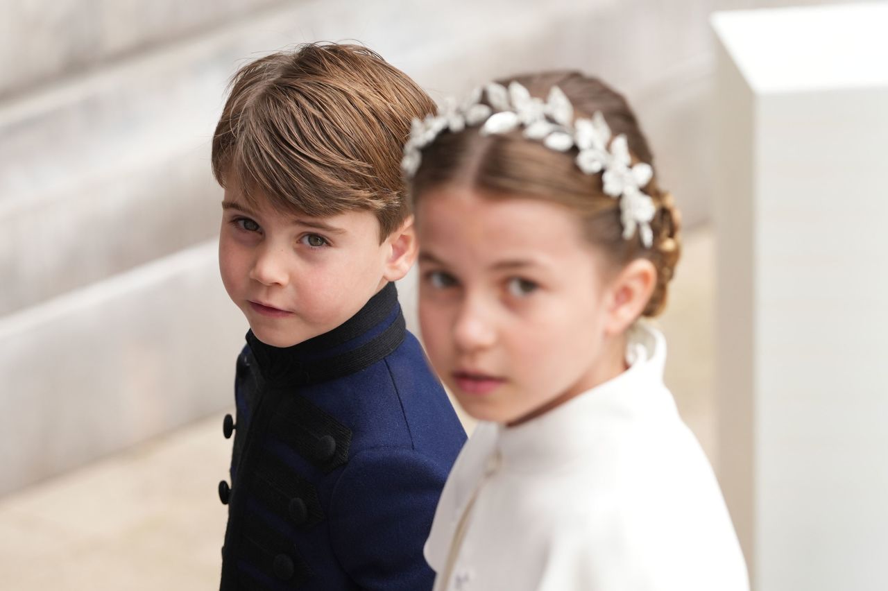 Prince Louis and Princess Charlotte, two of the King's grandchildren, arrive for the coronation.
