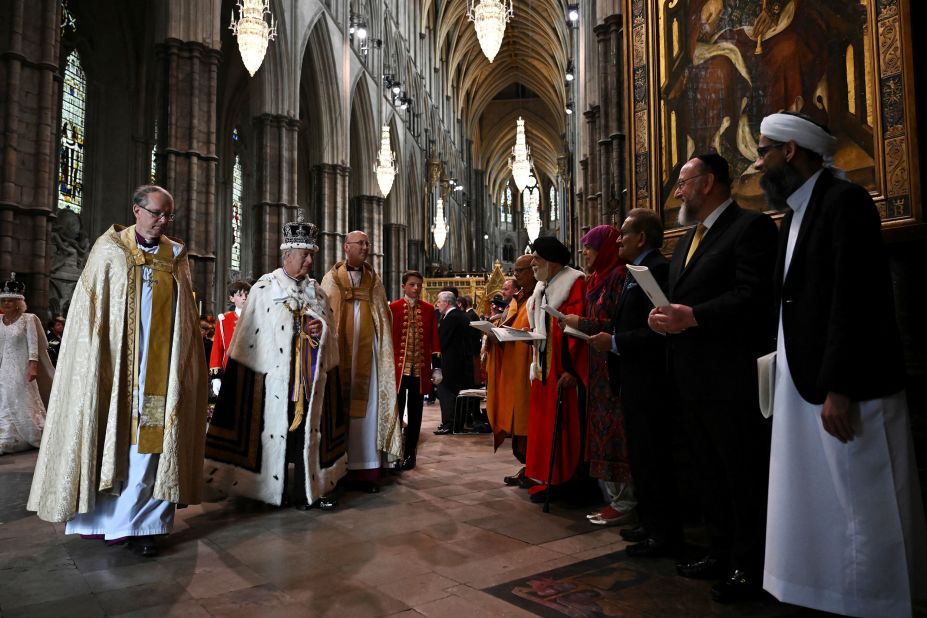 The King greets multifaith leaders on his way out of Westminster Abbey.