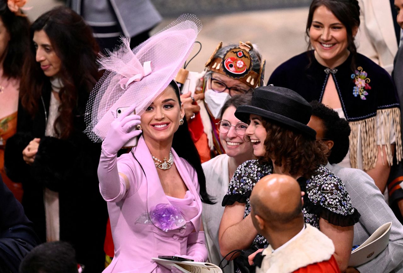Singer Katy Perry takes a selfie with guests at Westminster Abbey. The coronation guests included <a href="https://www.cnn.com/uk/live-news/king-charles-iii-coronation-ckc-intl-gbr/h_6381e2bc126c139f48714994a44b7510" target="_blank">celebrities and world leaders</a>.