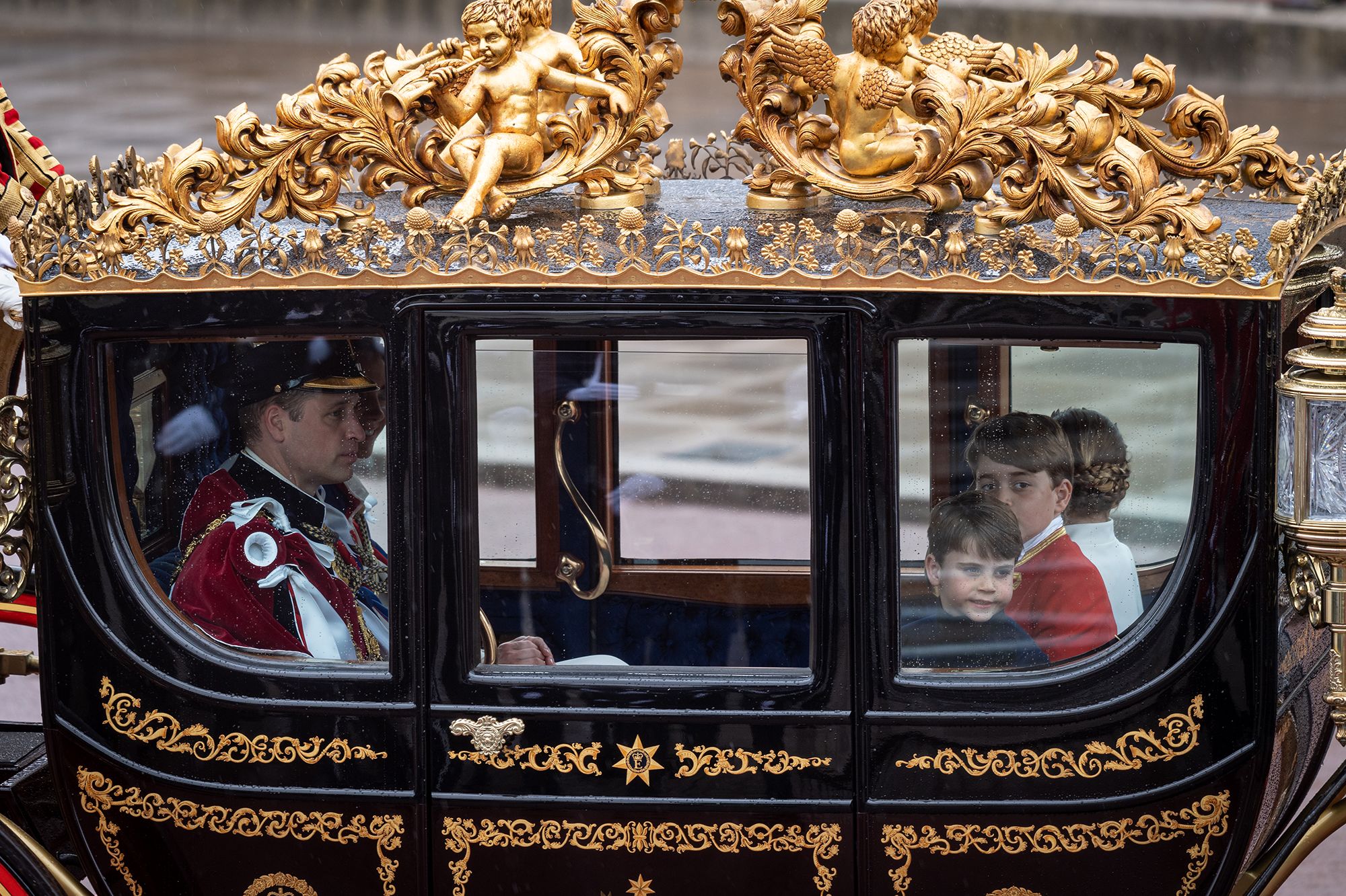 Prince William heads back to Buckingham Palace with Catherine and their three children.