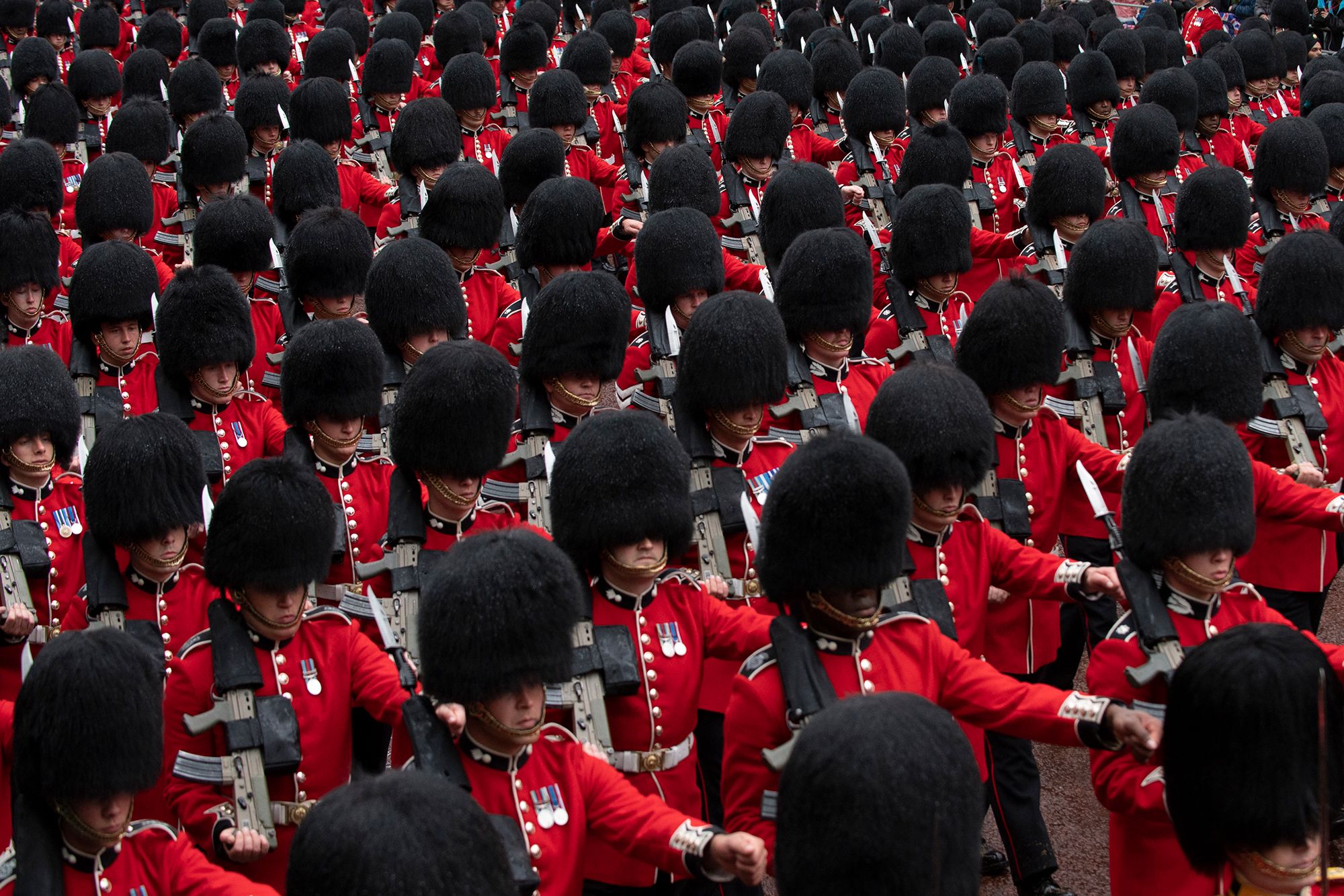 Troops march in London for the King's coronation.