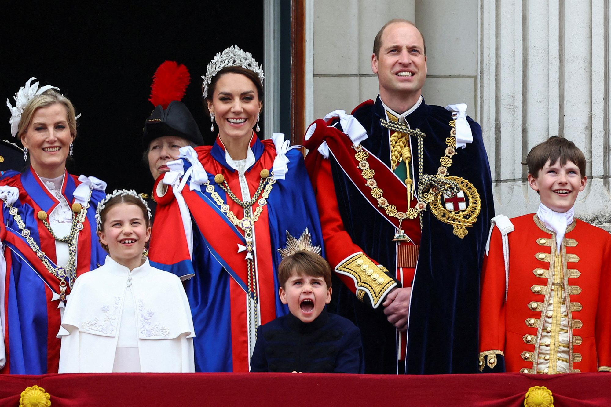 Some members of the royal family appear on the palace balcony after the coronation.