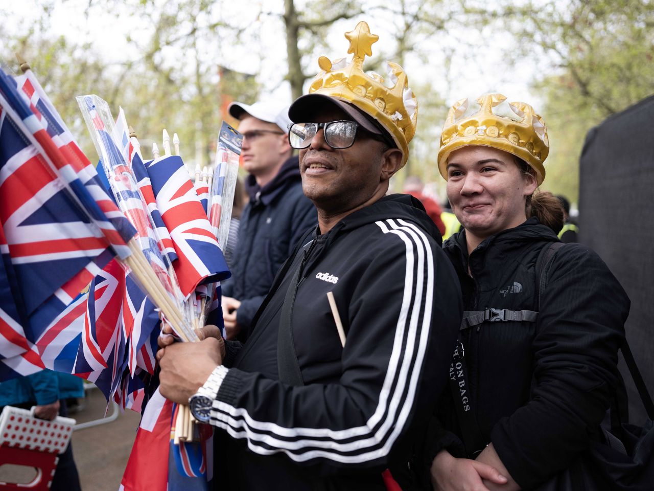 Paul, from London, was selling flags along the procession route — but he said business would have been better if he could have gotten reception for his card swiper. "I'd be here if I was working or not," he said. "I came to the Queen's birthday every year and I love the royals. Charles is all right."