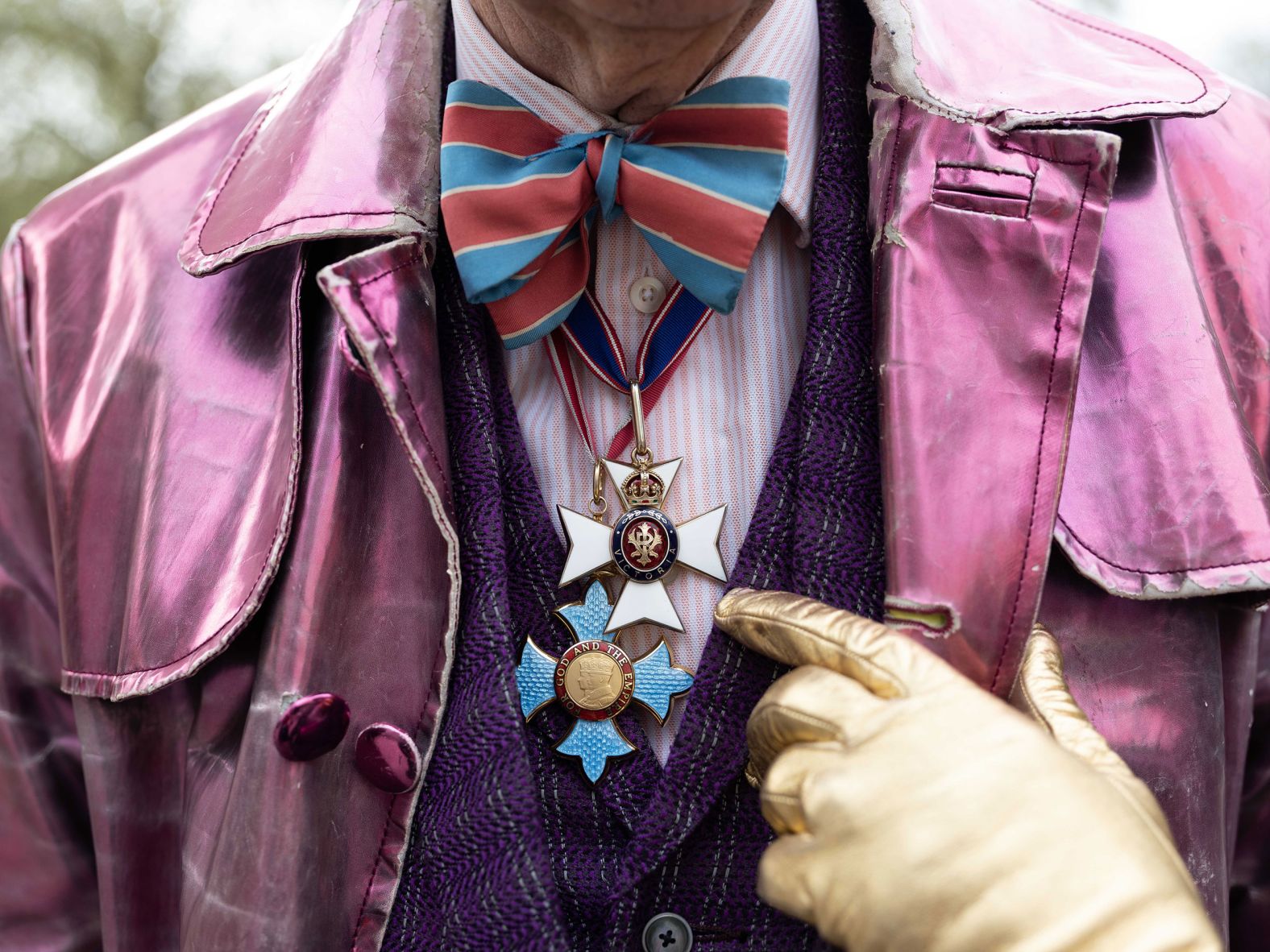 Robin Wight, who was celebrating the coronation along with his wife, Countess Paola Kovacz von Csaky, shows off the orders of knighthood and chivalry that he has received in his lifetime. "My CVO (Commander of the Royal Victorian Order) was for raising 65 million for the Duke of Edinburgh in 1999," he said. "And my CBE (Commander of the British Empire) was for setting up a charity called the Ideas Foundation, which gets kids from disadvantaged backgrounds into creative industries." Wight said he and his wife queued for 10 days to say goodbye to Queen Elizabeth II, and now they were here to say "hello" to King Charles III. "We worked together for 20 years, and I've known how great he is," Wight said. "He stepped into his mother's shoes so brilliantly."