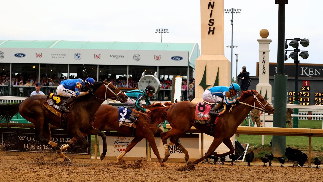 Mage (8), ridden by jockey Javier Castellano crosses the finish line to win the 149th running of the Kentucky Derby at Churchill Downs on May 6, 2023 in Louisville, Kentucky.