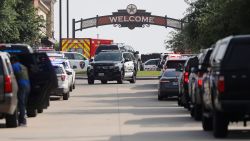 ALLEN, TEXAS - MAY 6: Emergency vehicles line the entrance to the Allen Premium Outlets where a shooting took place on May 6, 2023 in Allen, Texas. According to reports, a shooter opened fire at the outlet mall, injuring at least nine people who were taken to local hospitals. The police have confirmed there were fatalities but have not specified how many. The unidentified shooter was neutralized by an Allen Police officer responding to an unrelated call. (Photo by Stewart  F. House/Getty Images)