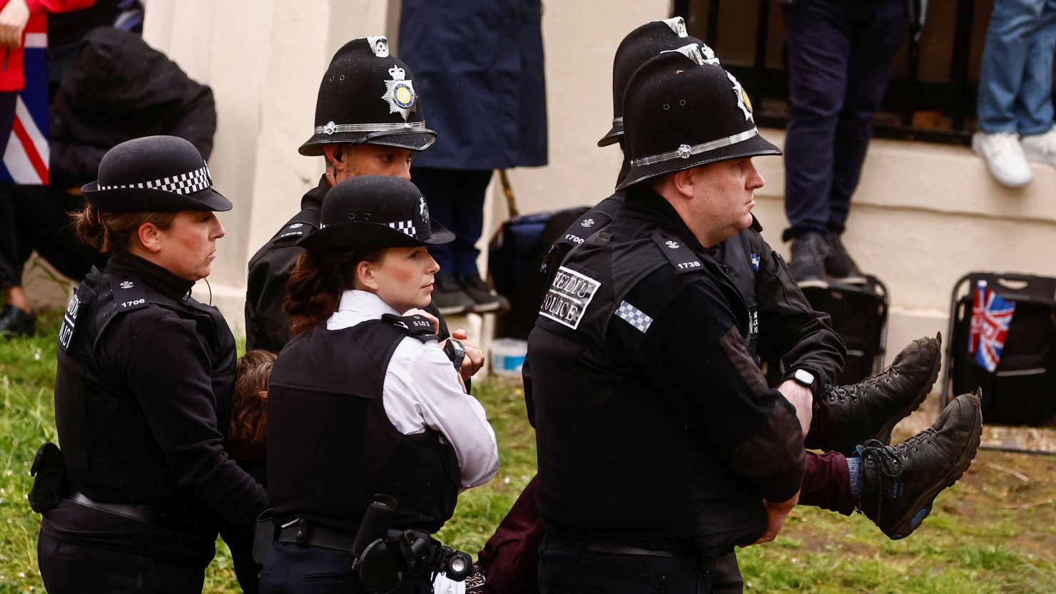 Police officers detain a member of "Just Stop Oil" movement during a protest ahead of King Charles' procession to his coronation ceremony, at The Mall in London, on May 6, 2023. 