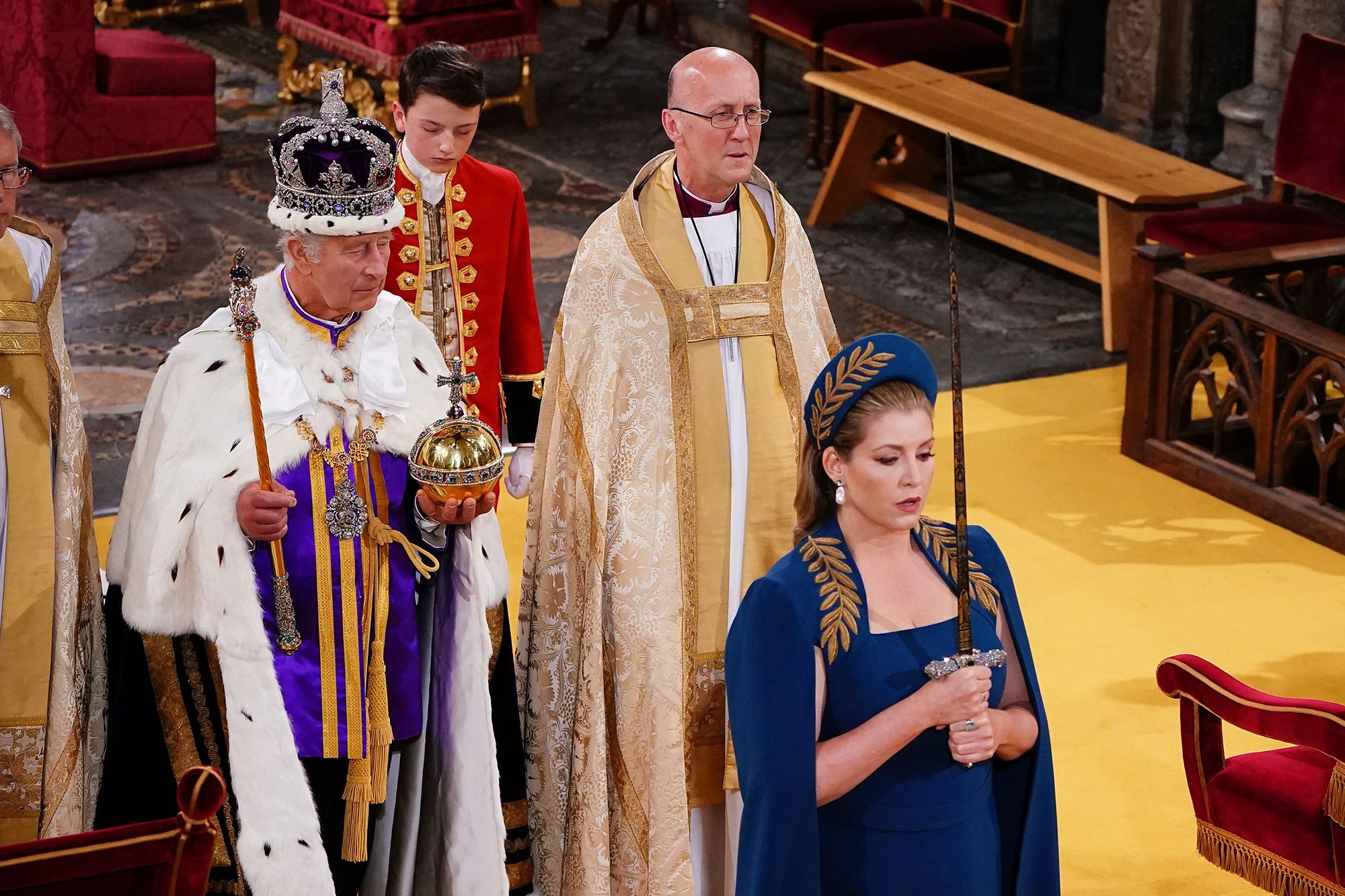 British lawmaker Penny Mordaunt carries the Sword of State during the coronation.