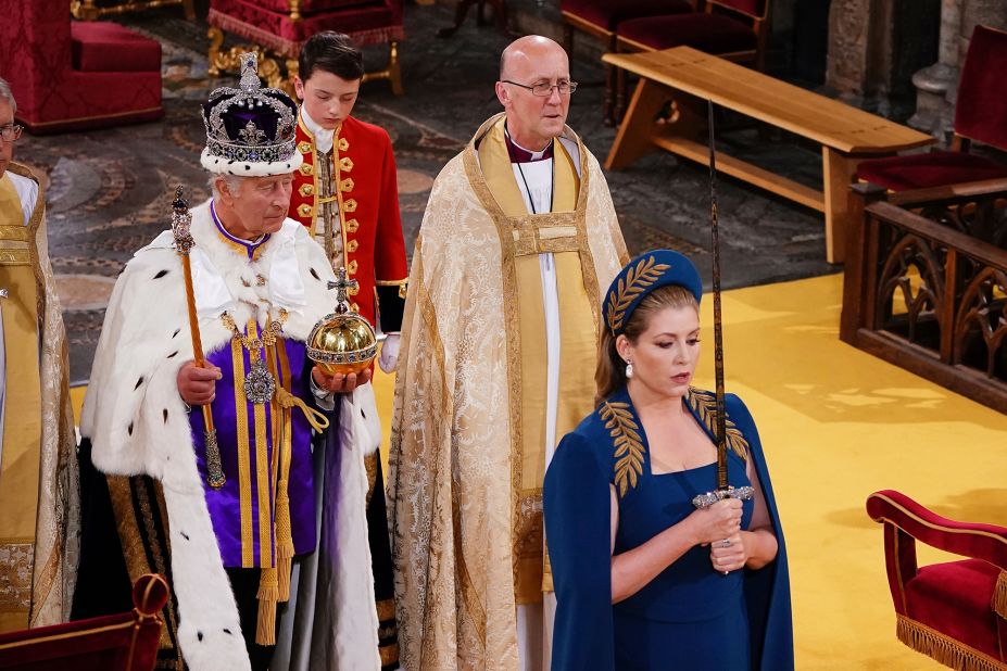 British lawmaker Penny Mordaunt carries the Sword of State during the coronation. She was involved in the ceremony because as the current Leader of the House of Commons, she is also the Lord President of the Privy Council — a body formed of senior politicians who act as the monarch's official advisers.