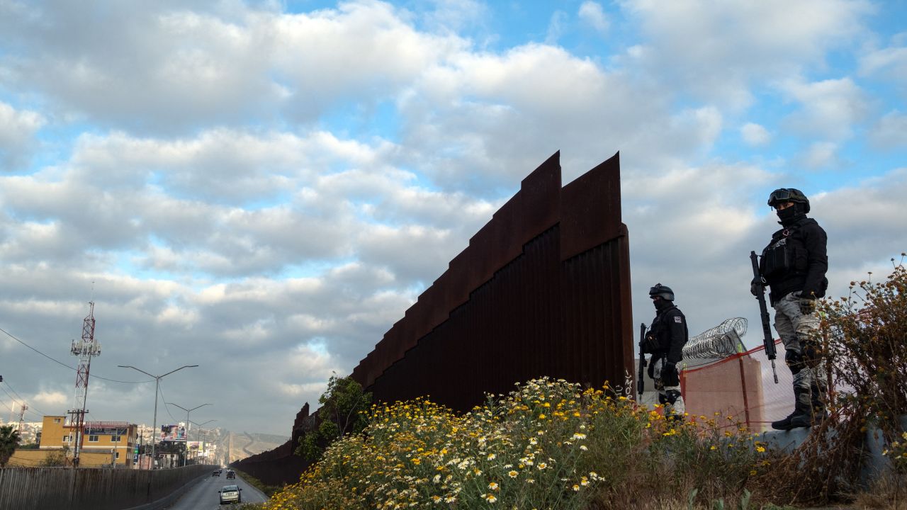 The Mexican National Guard patrols an open section of the border wall in Tijuana on Saturday, May 6.