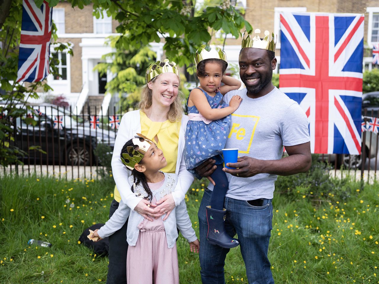 London locals Dayo and Claire celebrated with their kids Florence, 5, and Kesia, 3. "I think the King has got a tough job," Dayo said. "Once you're in a position like that it's polarizing. Whether you asked for it or not, everyone's got an opinion. Heavy is the head that wears the crown."